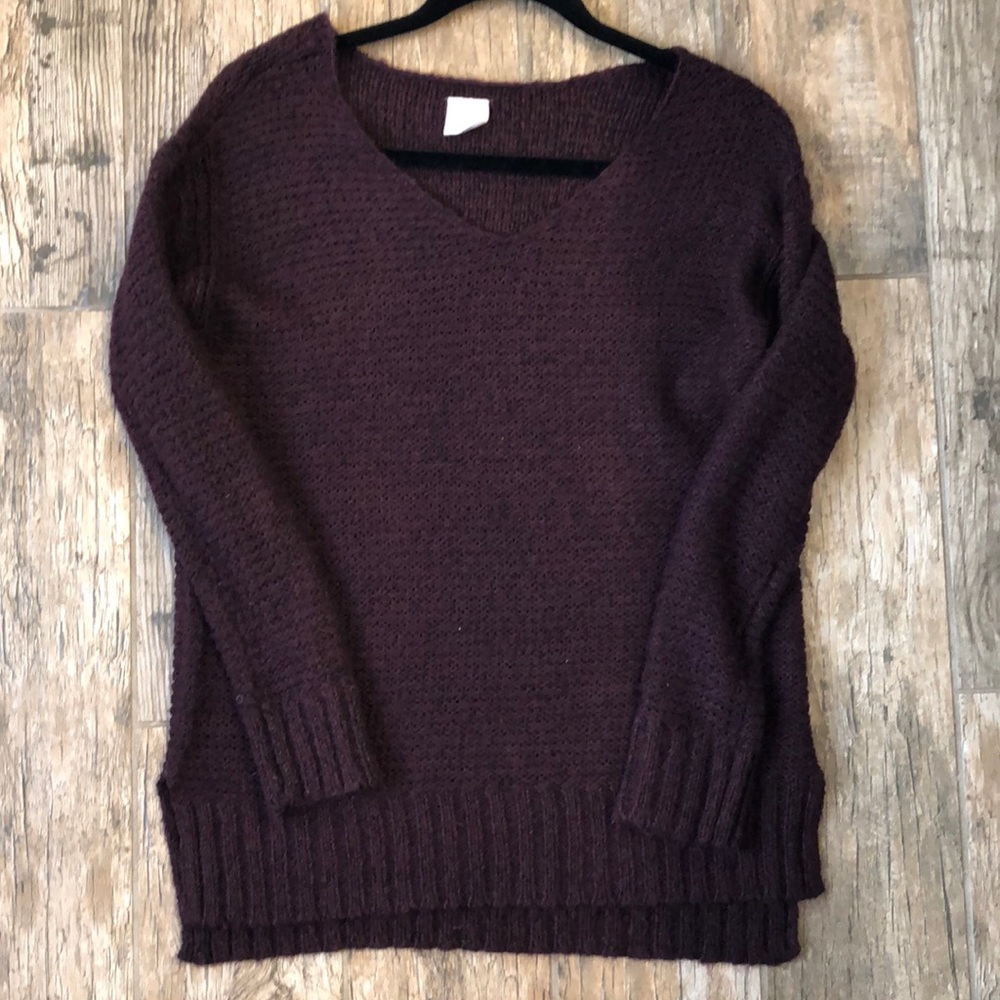 Knit burgundy sweater.